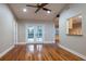 Large living area with pass through view into kitchen and hardwood floors at 789 Barger Dr, Deltona, FL 32738
