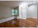 Vaulted ceiling living room with lots of natural light and hardwood floors at 789 Barger Dr, Deltona, FL 32738