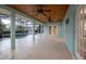 Covered outdoor patio overlooking the pool area and lush landscaping at 789 Barger Dr, Deltona, FL 32738