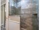 Modern shower stall featuring stylish gray tiling and glass door at 789 Barger Dr, Deltona, FL 32738