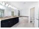 Bright primary bathroom with double sinks, a soaking tub, and a separate toilet room at 7931 Rock Dove Dr, Winter Garden, FL 34787