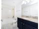 Bright bathroom featuring modern fixtures, granite countertops and tiled floors for easy cleaning at 7931 Rock Dove Dr, Winter Garden, FL 34787