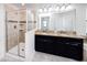 Bright primary bathroom with double sinks, and a glass enclosed shower at 7931 Rock Dove Dr, Winter Garden, FL 34787