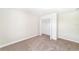 This bedroom has neutral walls and carpet along with a spacious closet at 7931 Rock Dove Dr, Winter Garden, FL 34787