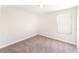 This bedroom has neutral walls and carpet along with a window at 7931 Rock Dove Dr, Winter Garden, FL 34787