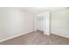 This bedroom has neutral walls and carpet along with a spacious closet at 7931 Rock Dove Dr, Winter Garden, FL 34787