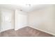 This bedroom has neutral walls and carpet along with a double-door closet at 7931 Rock Dove Dr, Winter Garden, FL 34787