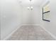 The dining room has neutral walls and tile floor as well as a chandelier at 7931 Rock Dove Dr, Winter Garden, FL 34787
