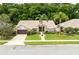 Aerial view of home with well-manicured landscaping and a two car garage at 812 Silverwood Dr, Lake Mary, FL 32746