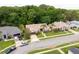 Aerial view of a residential street showcasing a well-maintained home, driveway, and mature trees at 812 Silverwood Dr, Lake Mary, FL 32746