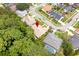 An aerial shot reveals the home's location among mature trees and a neatly planned neighborhood layout at 812 Silverwood Dr, Lake Mary, FL 32746