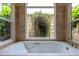 A close view of the bathtub under a big window offering lots of greenery at 812 Silverwood Dr, Lake Mary, FL 32746