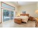 Bright bedroom features a sliding glass door to the screened lanai and pool area at 812 Silverwood Dr, Lake Mary, FL 32746