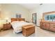 Spacious bedroom with tile floors and traditional wood furniture at 812 Silverwood Dr, Lake Mary, FL 32746