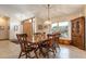 Charming dining room with wooden table, chairs, and window with natural light at 812 Silverwood Dr, Lake Mary, FL 32746