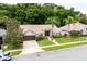 Charming single-story home with lush landscaping, palm trees, and a well-manicured lawn at 812 Silverwood Dr, Lake Mary, FL 32746