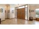 Elegant foyer features double doors, tile floors, and transom windows for natural light at 812 Silverwood Dr, Lake Mary, FL 32746