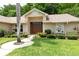 Home with a welcoming double door entrance, lush landscaping, and a cozy ambiance at 812 Silverwood Dr, Lake Mary, FL 32746