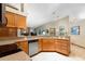 Open kitchen design with stone counters, a sink and great view of the living room at 812 Silverwood Dr, Lake Mary, FL 32746
