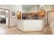 Open kitchen design with breakfast bar, stainless fridge and appliances at 812 Silverwood Dr, Lake Mary, FL 32746