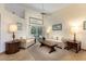 Cozy living room with neutral sofas, a ceiling fan, and sliding doors to the pool area at 812 Silverwood Dr, Lake Mary, FL 32746