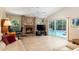 Open living room with fireplace, desk area, and screened patio and pool views at 812 Silverwood Dr, Lake Mary, FL 32746