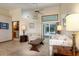 Bright living area with tile flooring, comfortable seating, and a view of the pool at 812 Silverwood Dr, Lake Mary, FL 32746