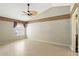 A bright bedroom featuring high ceilings, a fan, and a neutral color scheme at 826 Bright Meadow Dr, Lake Mary, FL 32746