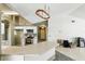 Bright kitchen features white cabinets, stainless appliances, and a breakfast bar at 826 Bright Meadow Dr, Lake Mary, FL 32746