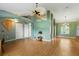 Bright living room featuring laminated wood floors, stylish lighting, and open design at 826 Bright Meadow Dr, Lake Mary, FL 32746
