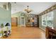Open living room featuring laminated wood floors, a ceiling fan, and well-lit natural light at 826 Bright Meadow Dr, Lake Mary, FL 32746