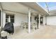 Covered patio with ceiling fan and outdoor dining set, perfect for entertaining at 826 Bright Meadow Dr, Lake Mary, FL 32746