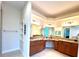 Spacious bathroom featuring dual sinks, granite countertops, and stylish fixtures at 871 Iron Oak Way, The Villages, FL 32163