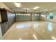Spacious three-car garage with epoxy floors and plenty of storage cabinets at 871 Iron Oak Way, The Villages, FL 32163