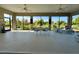 Enclosed outdoor patio with ceiling fans and great view at 871 Iron Oak Way, The Villages, FL 32163