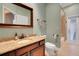 Light and airy bathroom with granite counters, tile floors, and a walk in shower at 914 Sweetgum Valley Pl, Lake Mary, FL 32746