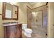 Bathroom featuring a vanity and a stand up shower with glass door and tile walls at 914 Sweetgum Valley Pl, Lake Mary, FL 32746