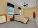 Comfortable bedroom with carpet floors, a ceiling fan, and bright windows at 914 Sweetgum Valley Pl, Lake Mary, FL 32746