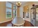 Dining area featuring hardwood floors, natural light, and a chandelier at 914 Sweetgum Valley Pl, Lake Mary, FL 32746