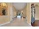 Open hallway featuring tile and wood flooring with neutral wall colors at 914 Sweetgum Valley Pl, Lake Mary, FL 32746