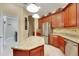 Well-equipped kitchen with granite countertops, stainless steel appliances, and center island at 914 Sweetgum Valley Pl, Lake Mary, FL 32746