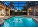 Beautiful in-ground pool with clean, clear water and a screened enclosure at 914 Sweetgum Valley Pl, Lake Mary, FL 32746