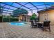 Beautiful in-ground pool with an outdoor seating area and cabana at 914 Sweetgum Valley Pl, Lake Mary, FL 32746