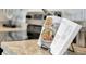 Kitchen countertop featuring a bookstand displaying a cookbook at 939 Princess Sabal Pt, Haines City, FL 33844
