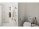 Bright half bathroom with white fixtures and tile flooring at 9567 Meadow Hunt Way, Winter Garden, FL 34787