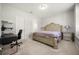 Comfortable bedroom with a work desk, ceiling light, and purple accents at 9567 Meadow Hunt Way, Winter Garden, FL 34787