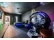 Gamer's bedroom is complete with cosmic themed mural, gaming station, and seating at 9567 Meadow Hunt Way, Winter Garden, FL 34787