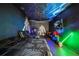 Unique bedroom boasts a cosmic theme with custom artwork and entertainment setup at 9567 Meadow Hunt Way, Winter Garden, FL 34787