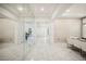 Bright foyer with decorative wallpaper, mirror, and an open view into other living spaces at 9567 Meadow Hunt Way, Winter Garden, FL 34787