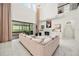 Spacious living room featuring a fireplace, lots of natural light, and a seamless indoor-outdoor flow at 9567 Meadow Hunt Way, Winter Garden, FL 34787